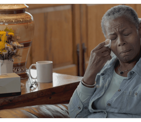 Black elderly woman in pain and crying